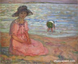 A girl in a pink robe by the sea