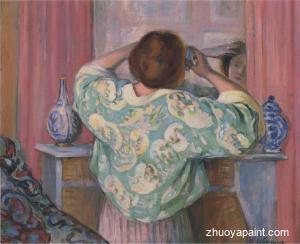 Woman doing her hair at the mirror